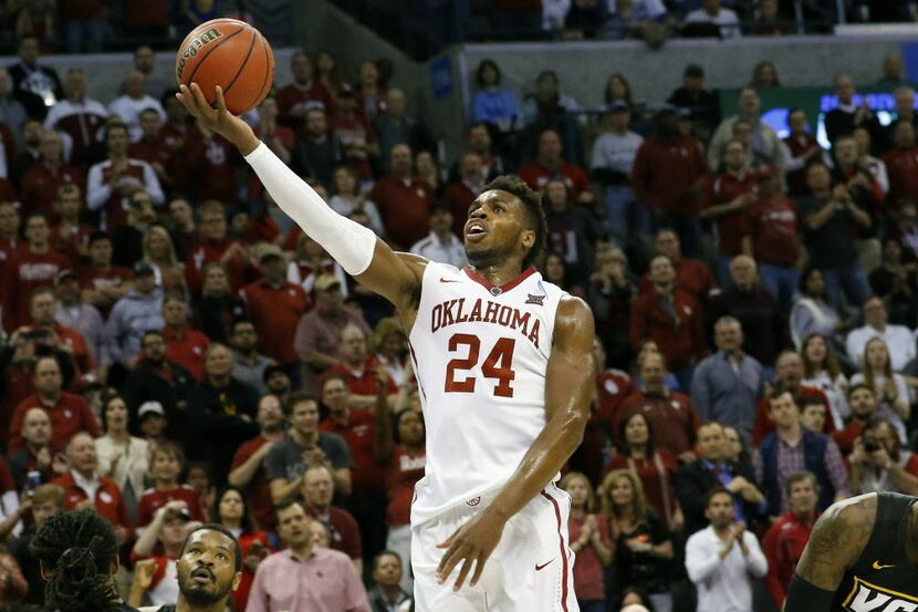 FILE - In this Sunday, March 20, 2016 file photo, Oklahoma guard Buddy Hield (24) goes up...