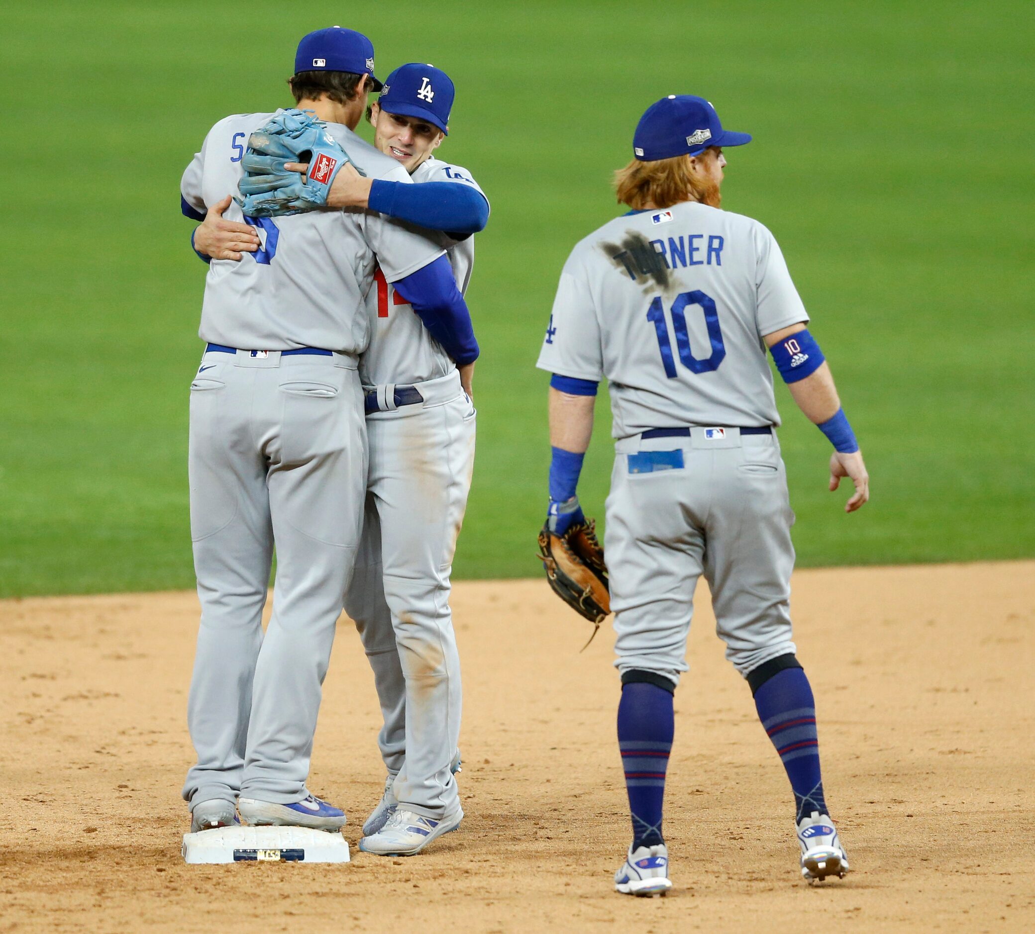 Los Angeles Dodgers shortstop Corey Seager (5) and Los Angeles Dodgers left fielder Enrique...