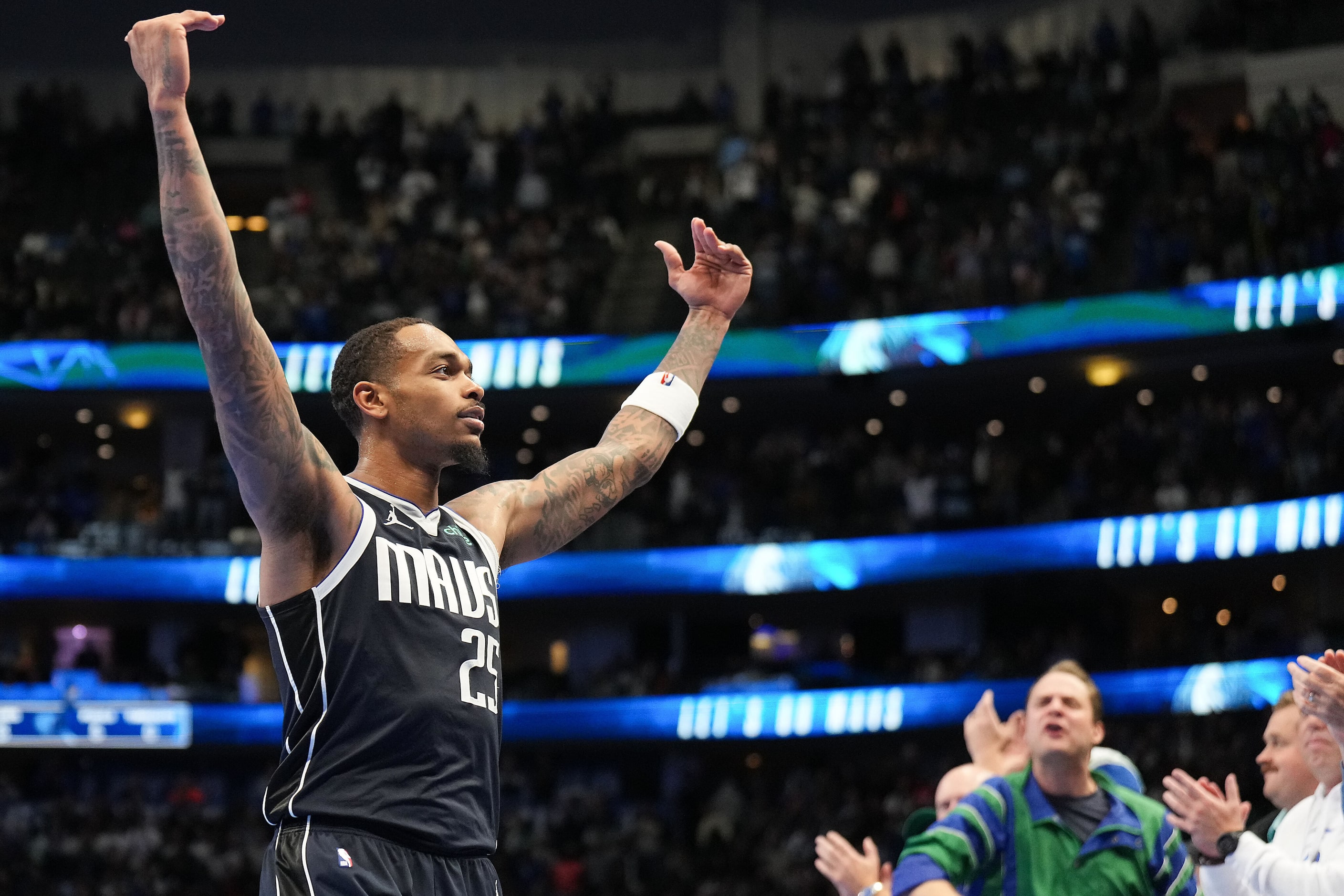 Dallas Mavericks forward P.J. Washington celebrates a late 3-pointer during the second half...