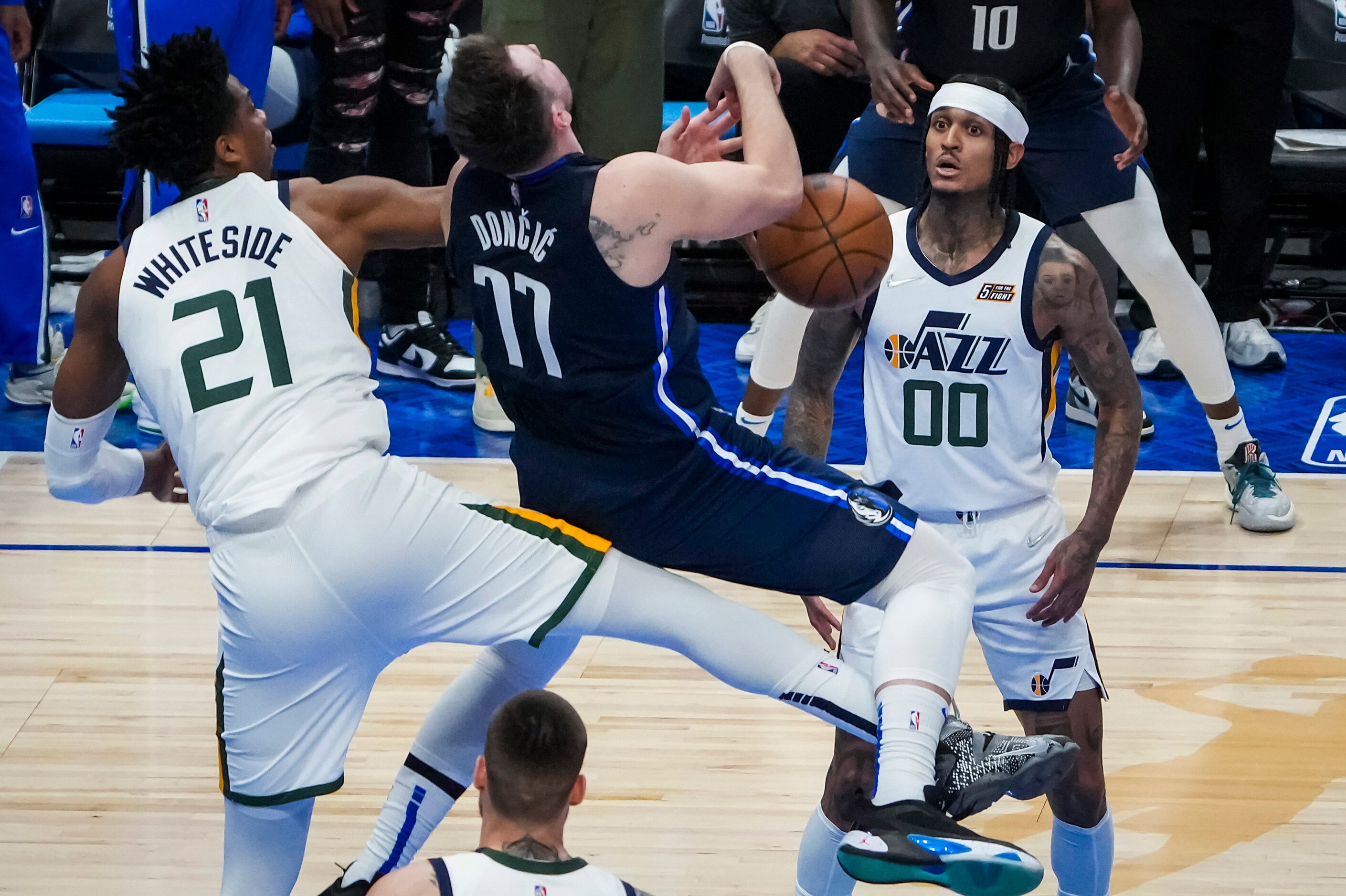 Dallas Mavericks guard Luka Doncic (77) is fouled by Utah Jazz center Hassan Whiteside (21)...