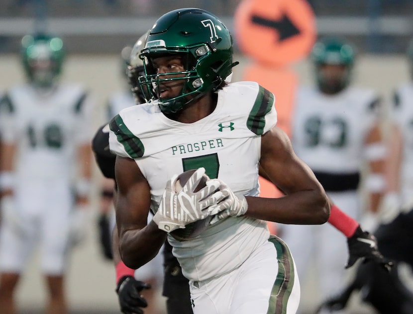 Prosper High School wide receiver Jayden Beasley (7) makes a run after the catch during the...