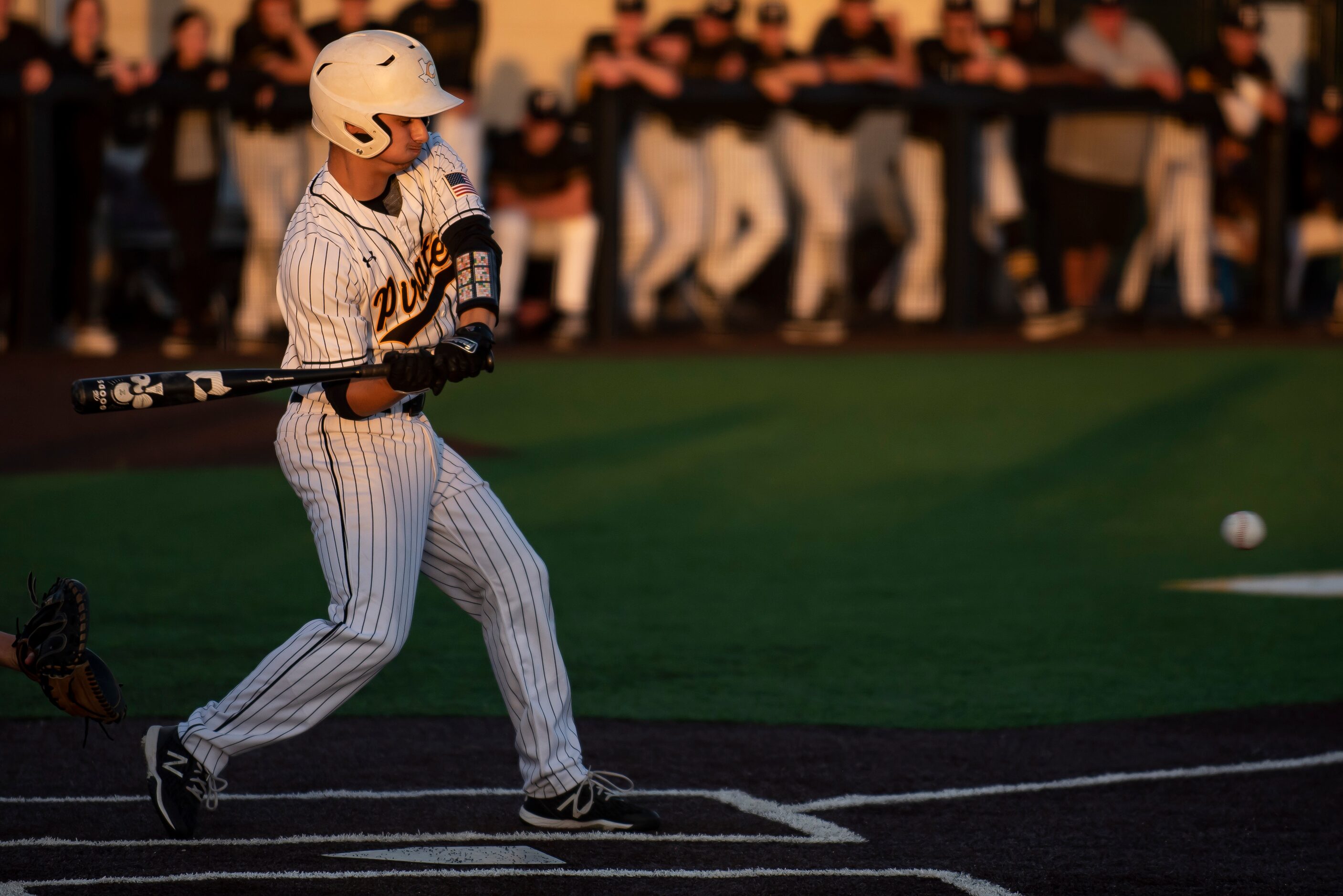 Crandall pitcher Landon Phillips (3) pulls his bat back as he watches a pitch during a...