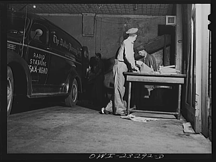Loading bundles of The Dallas Morning News onto trucks for delivery in April 1943.