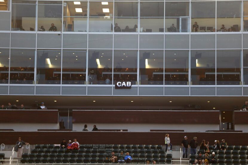 A banner reading CAB, which stands for Coach Art Briles (and on social media as #CAB ) hangs...