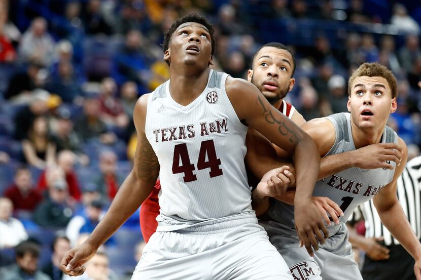 ST LOUIS, MO - MARCH 08:  Robert Williams #44 of the Texas A&M Aggies boxes out for a...