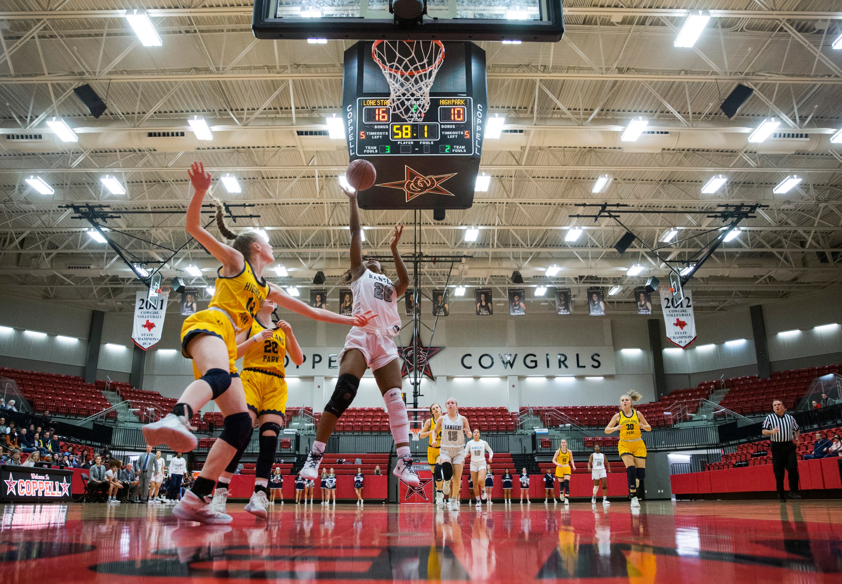 Frisco Lone Star forward Halley Carr (20 goes up for a shot during the second quarter of a...