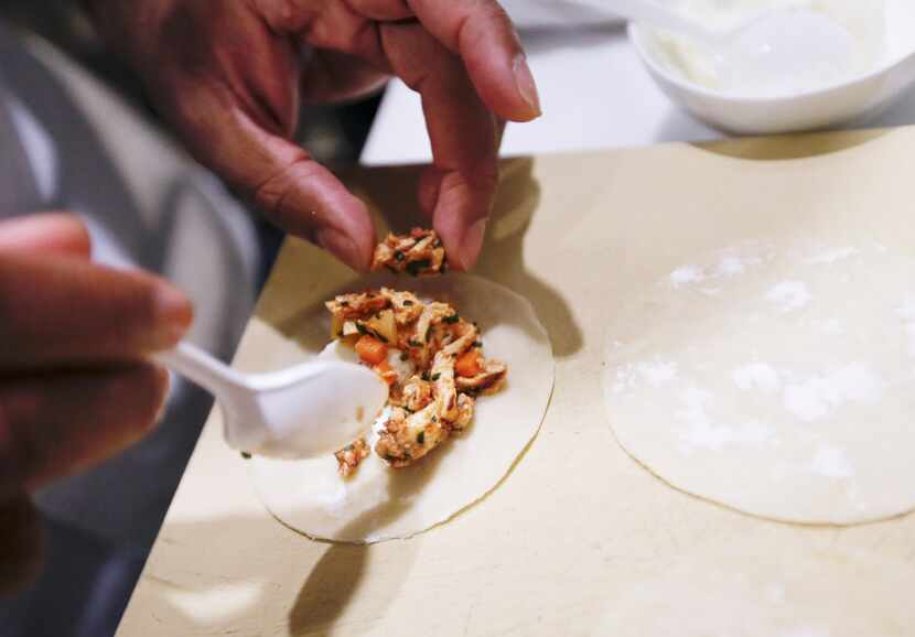 Junior Borges, executive chef of the Joule Hotel, prepares Coxinha com catupiry.