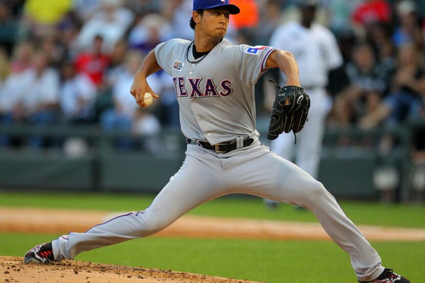 Aug 24, 2013; Chicago, IL, USA; Texas Rangers starting pitcher Yu Darvish (11) throws a...