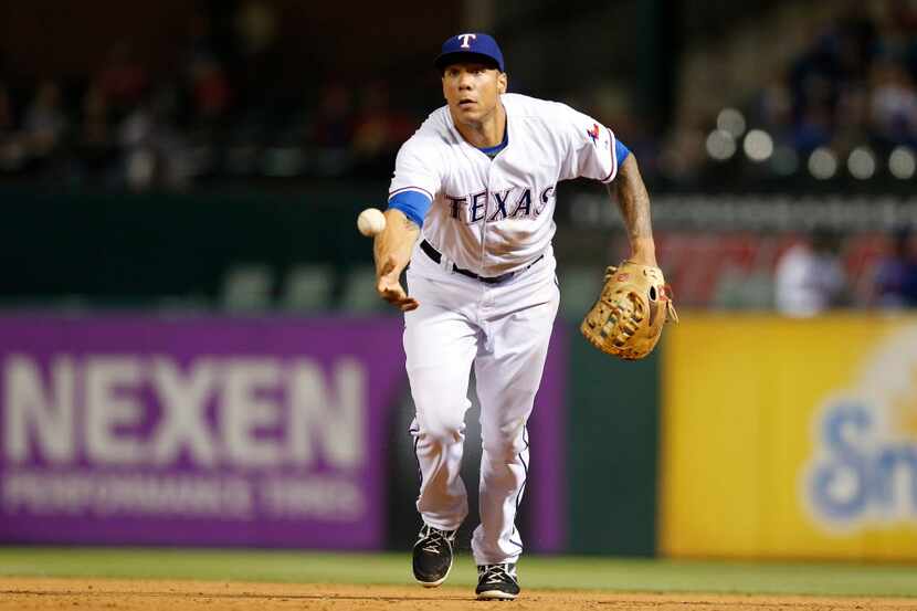 May 11, 2015; Arlington, TX, USA; Texas Rangers first baseman Kyle Blanks (88) tosses a ball...