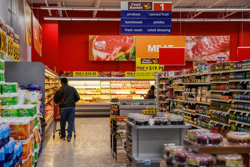 Customers at the new Food Basket at Simpson Stuart Rd in Dallas on Friday, Feb. 10, 2023.