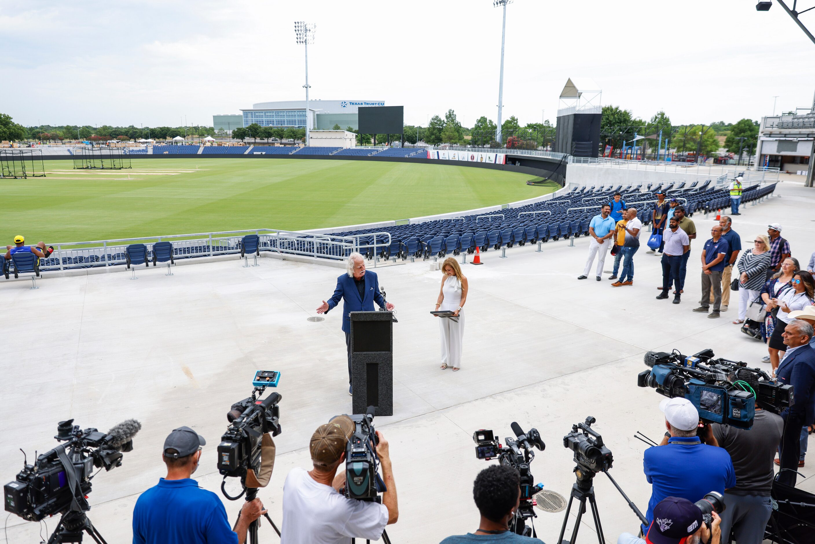 People and members of media gather as Mayor of Grand Prairie Ron Jensen speaks during the...