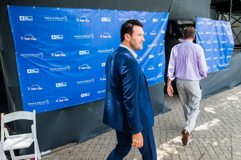 Former Dallas Cowboys quarterback Tony Romo walks to the CBS broadcast booth during round...