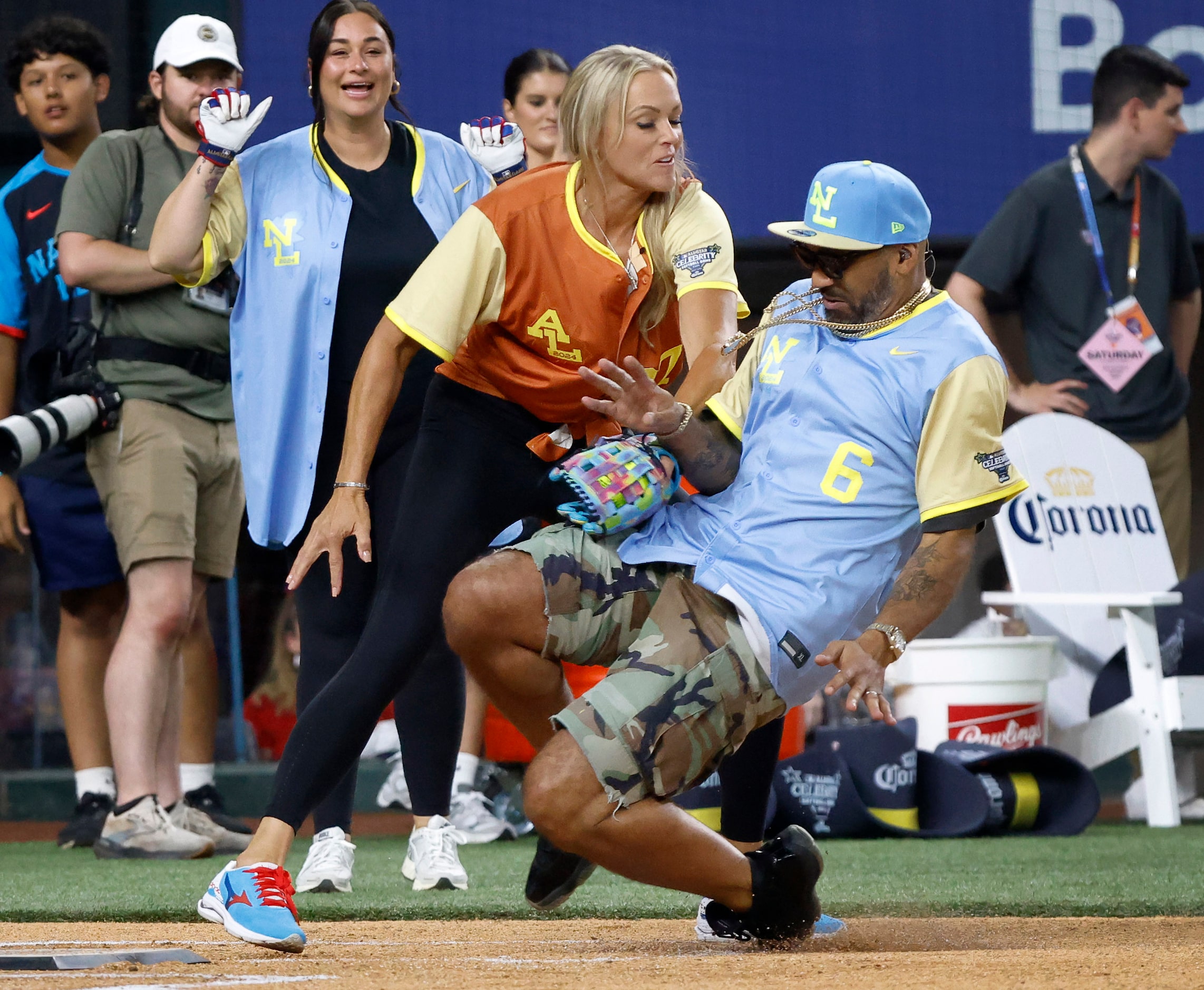 American League catcher Jennie Finch tags out National League’s The Kid Mero as he tried to...