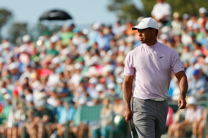 AUGUSTA, GEORGIA - APRIL 13: Tiger Woods of the United States walks on the 17th green during...