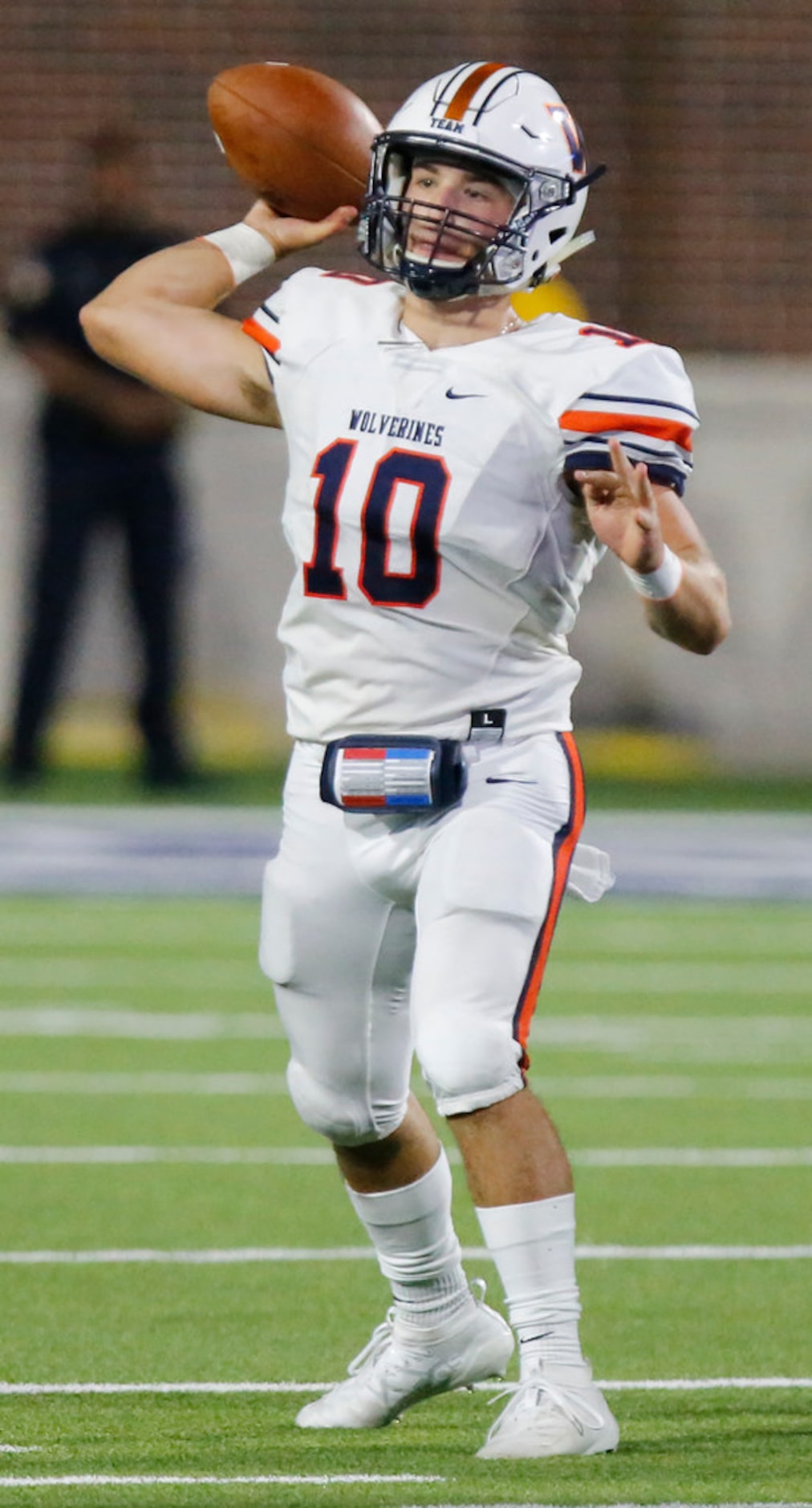 Wakeland High School quarterback Peyton Lewis (10) throws a pass during the first half as...