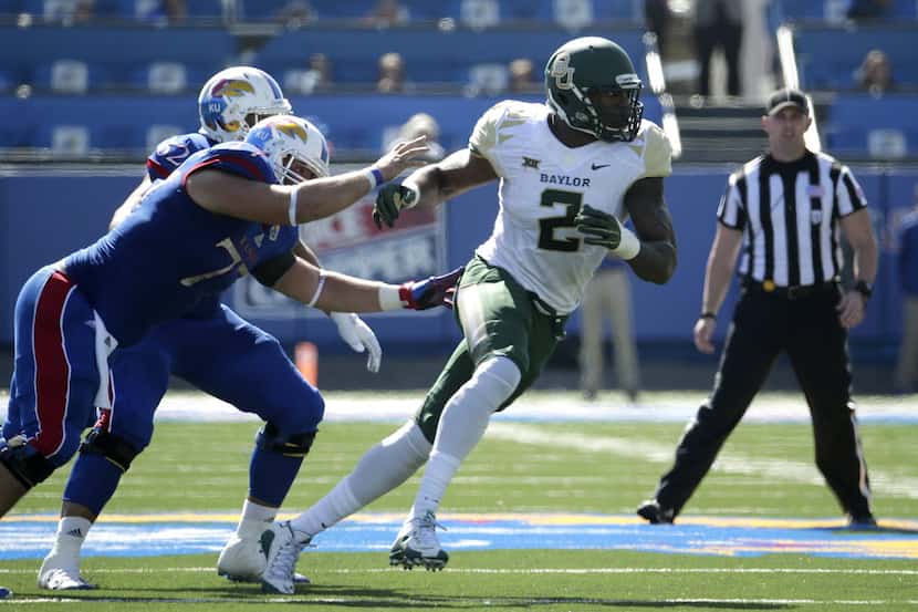 Baylor defensive end Shawn Oakman (2) rushes during the first half of an NCAA college...