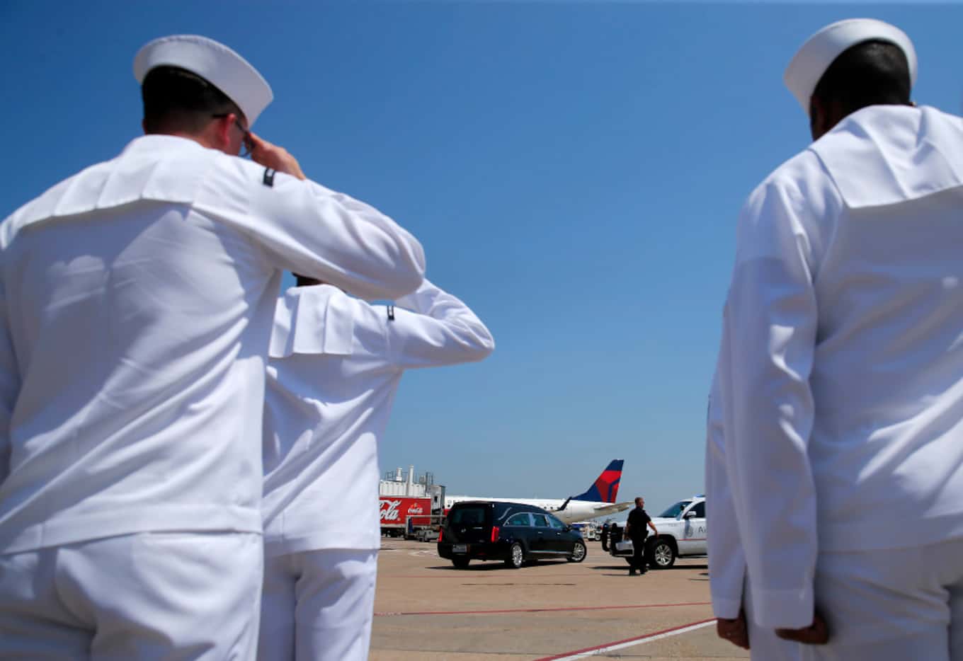 Members of the Naval Air Station Joint Reserve Base Fort Worth Honor Guard Team salute as...