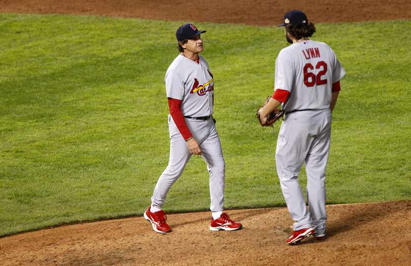 St. Louis Cardinals manager Tony LaRusa pulls relief pitcher Lance Lynn in the eighth inning...