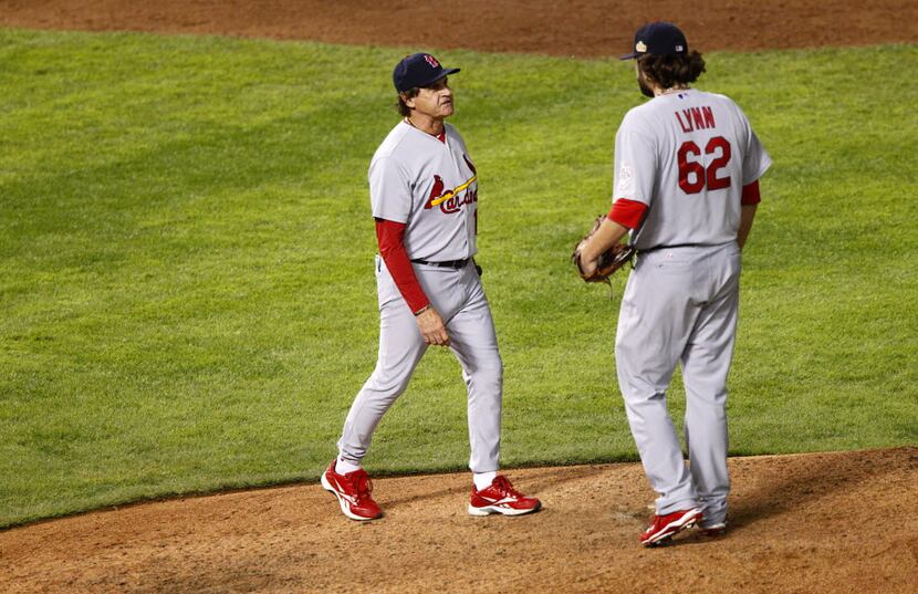 St. Louis Cardinals manager Tony LaRusa pulls relief pitcher Lance Lynn in the eighth inning...