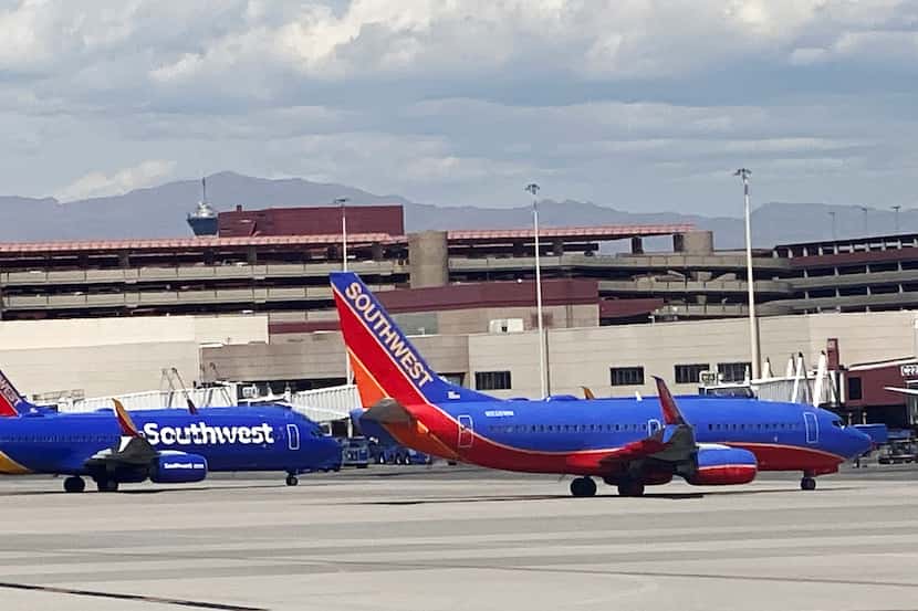 Southwest Airlines planes sit at the terminal at Harry Reid International Airport in Las...