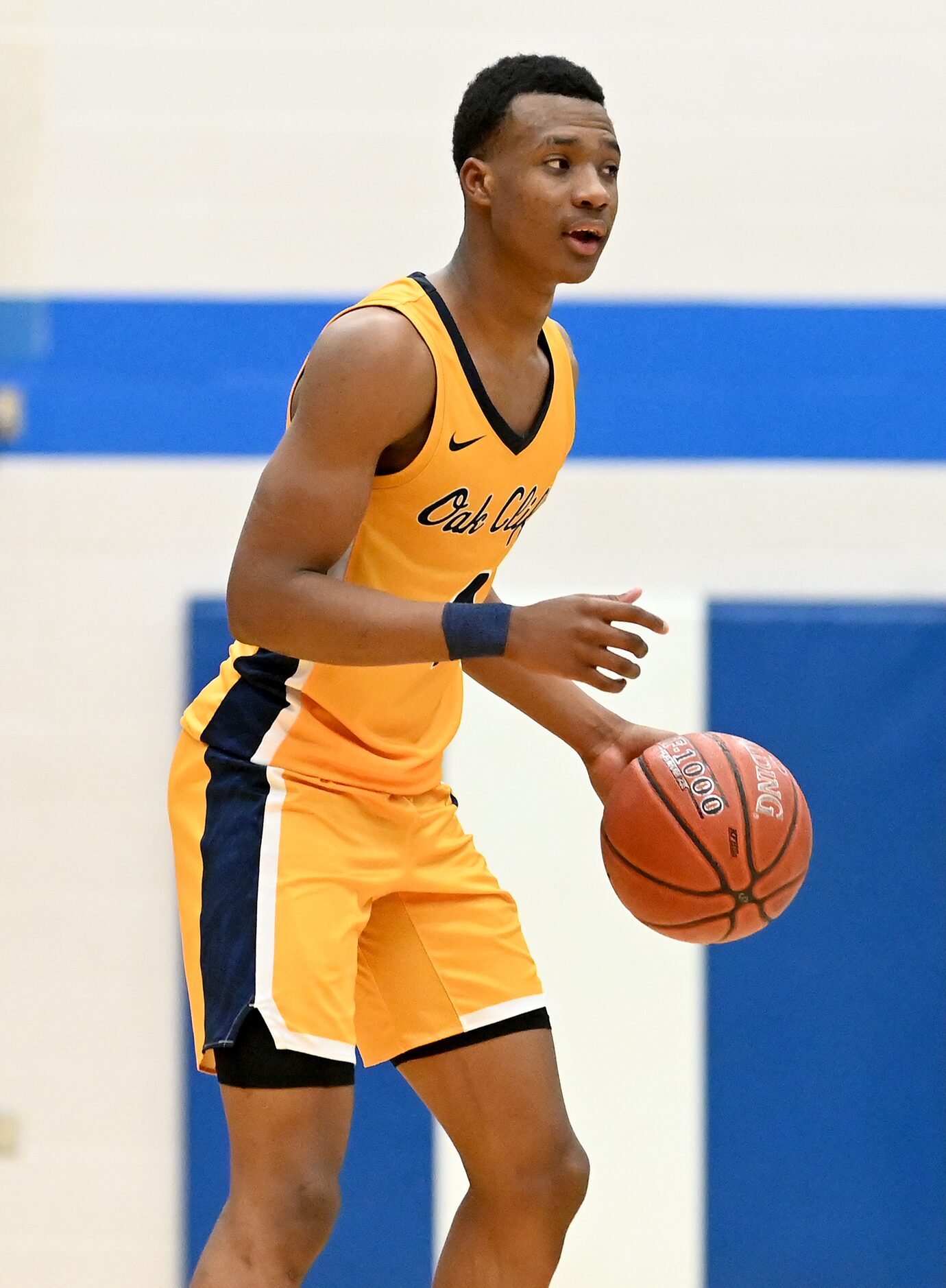 Faith Family’s T.J. Caldwell dribbles the ball in the second half during a Class 4A Region...