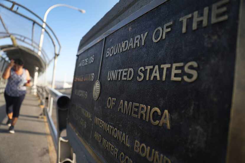 A plaque marks the U.S. border on the Paso Del Norte Port of Entry bridge connecting the...