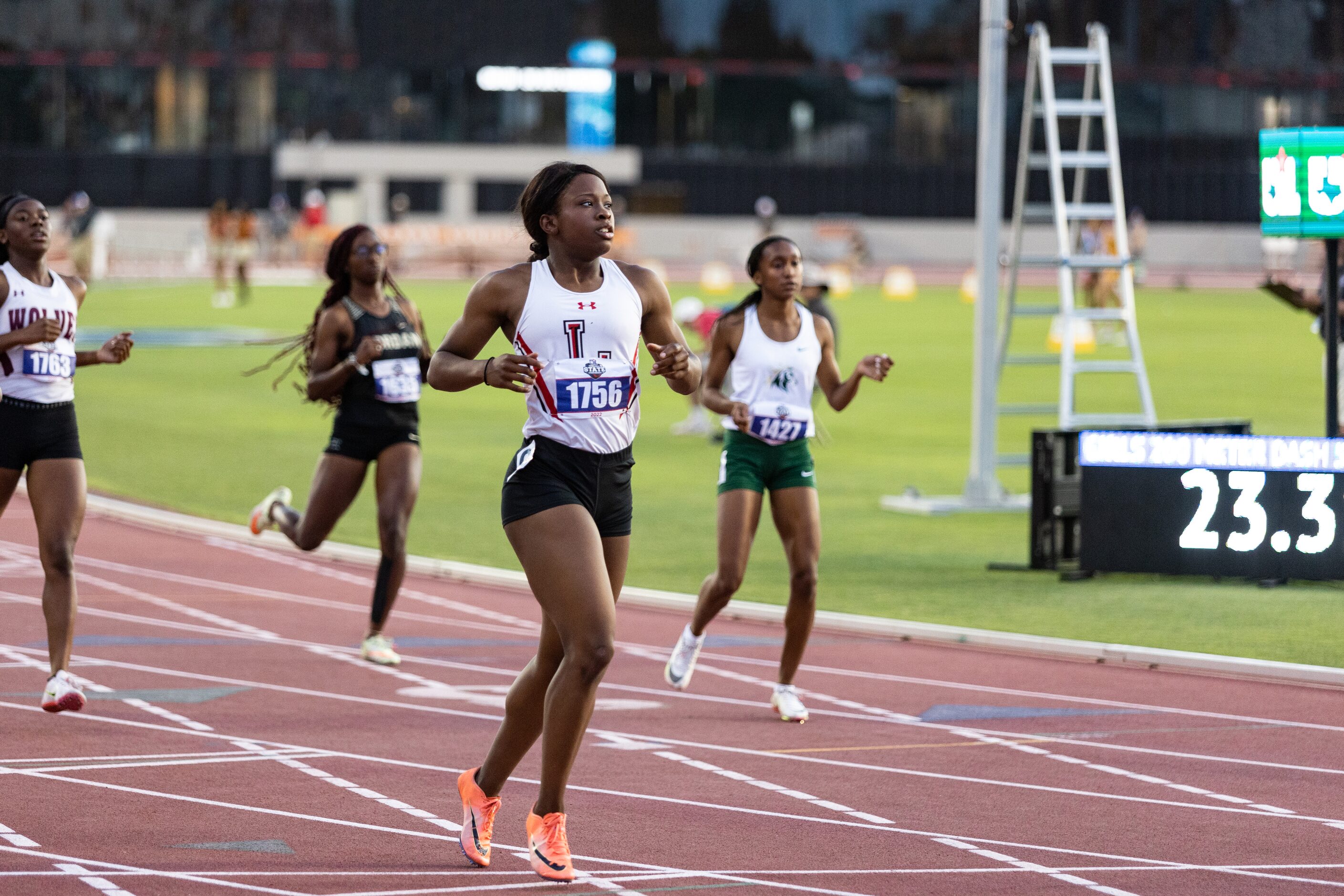 Christine Mallard of Mansfield Legacy looks for her time after crossing the finish line...