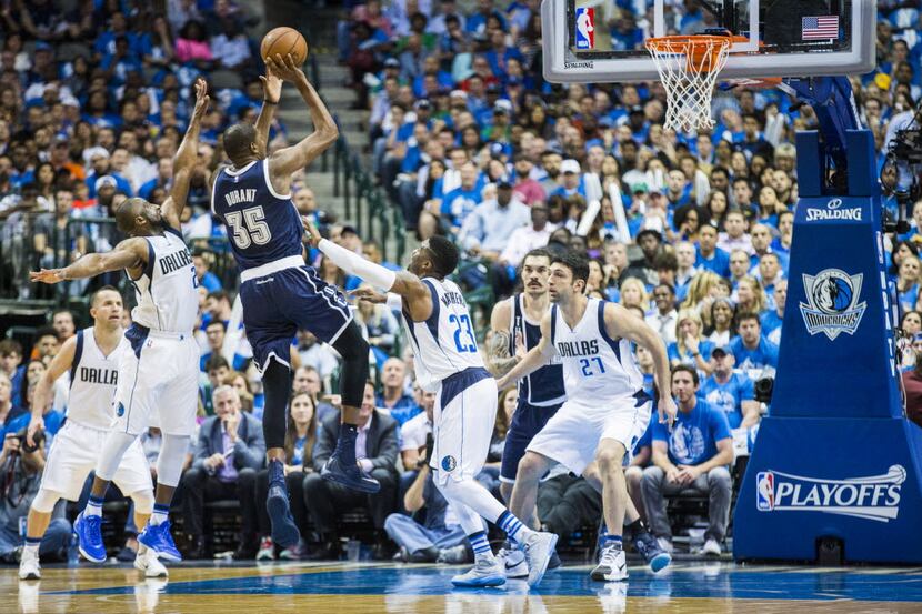 Oklahoma City Thunder forward Kevin Durant (35) takes a shot against the Dallas Mavericks...