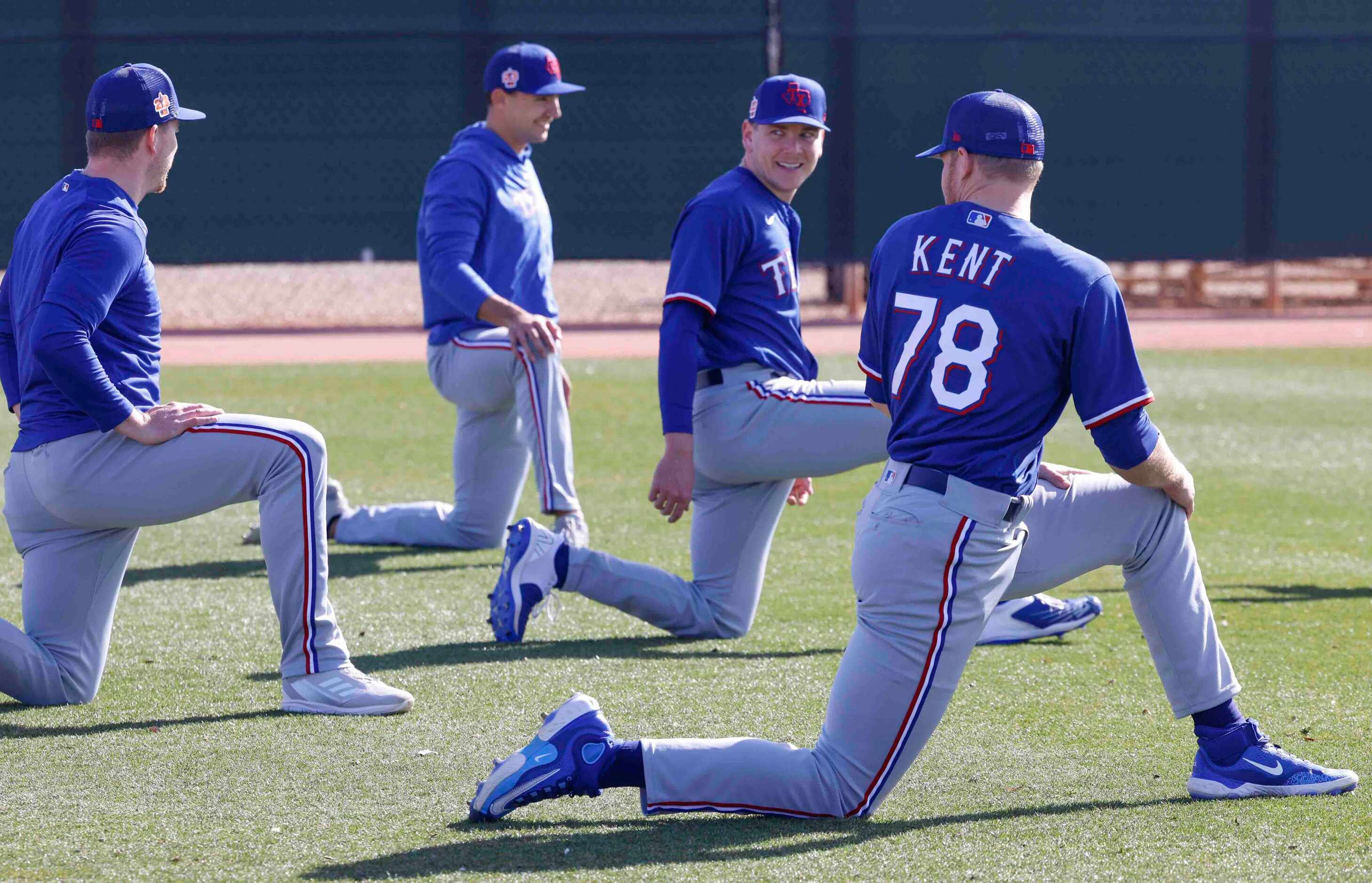 From left, Texas Rangers pitchers Josh Sborz, Brock Burke,  Spencer Howard, Zak Kent stretch...