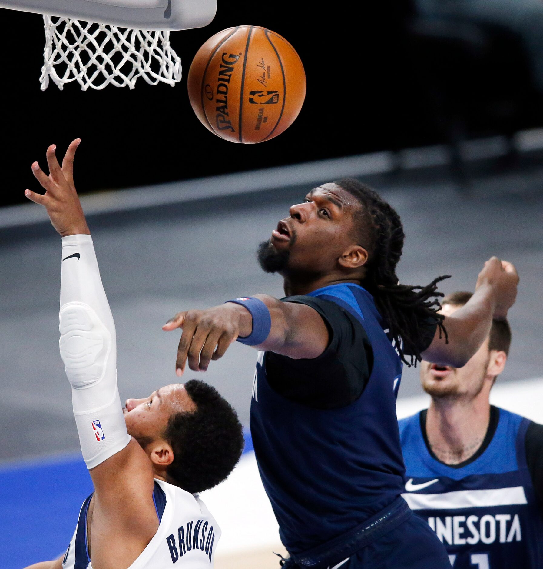 Minnesota Timberwolves center Naz Reid (11) blocks a shot by Dallas Mavericks guard Jalen...