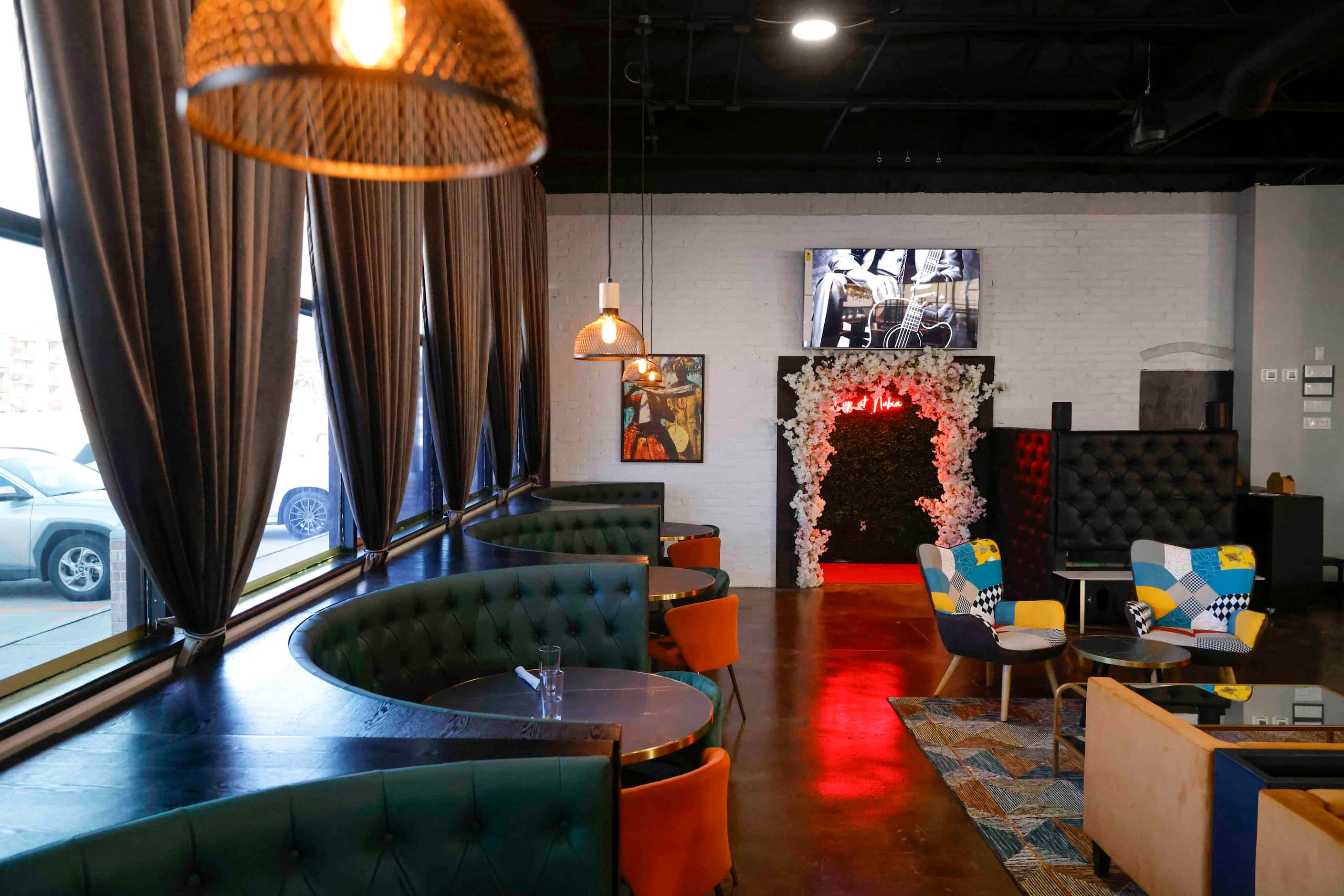 The interior of Cafe Nubia in Dallas is anchored by gold and black, with accents of bright...