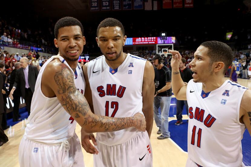 SMU Mustangs guard Keith Frazier (4), guard Nick Russell (12) and guard Nic Moore (11)...