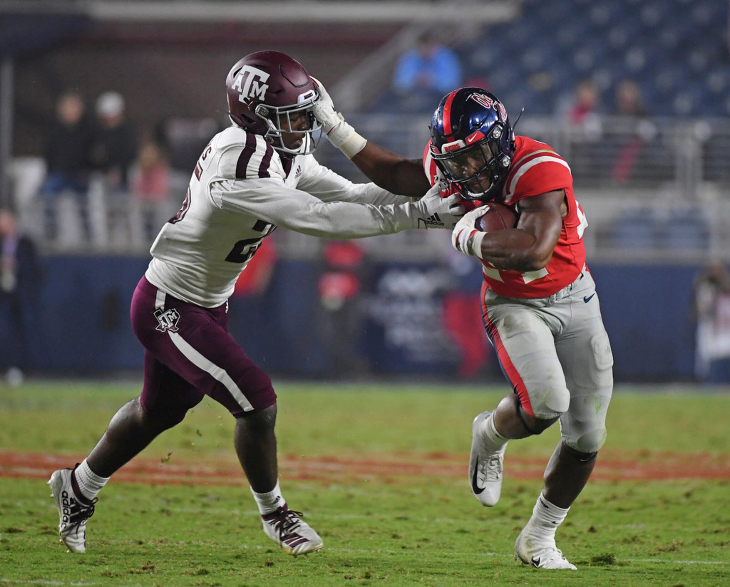 Mississippi running back Snoop Conner (24) stiff-arms Texas A&M defensive back Brian...