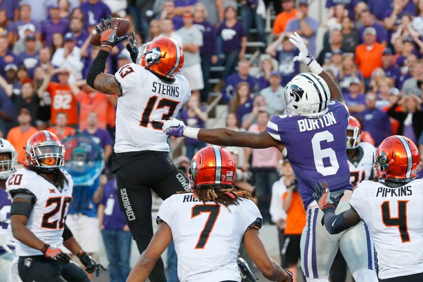Oklahoma State safety Jordan Sterns (13) intercepts a pass in the end zone from Kansas State...