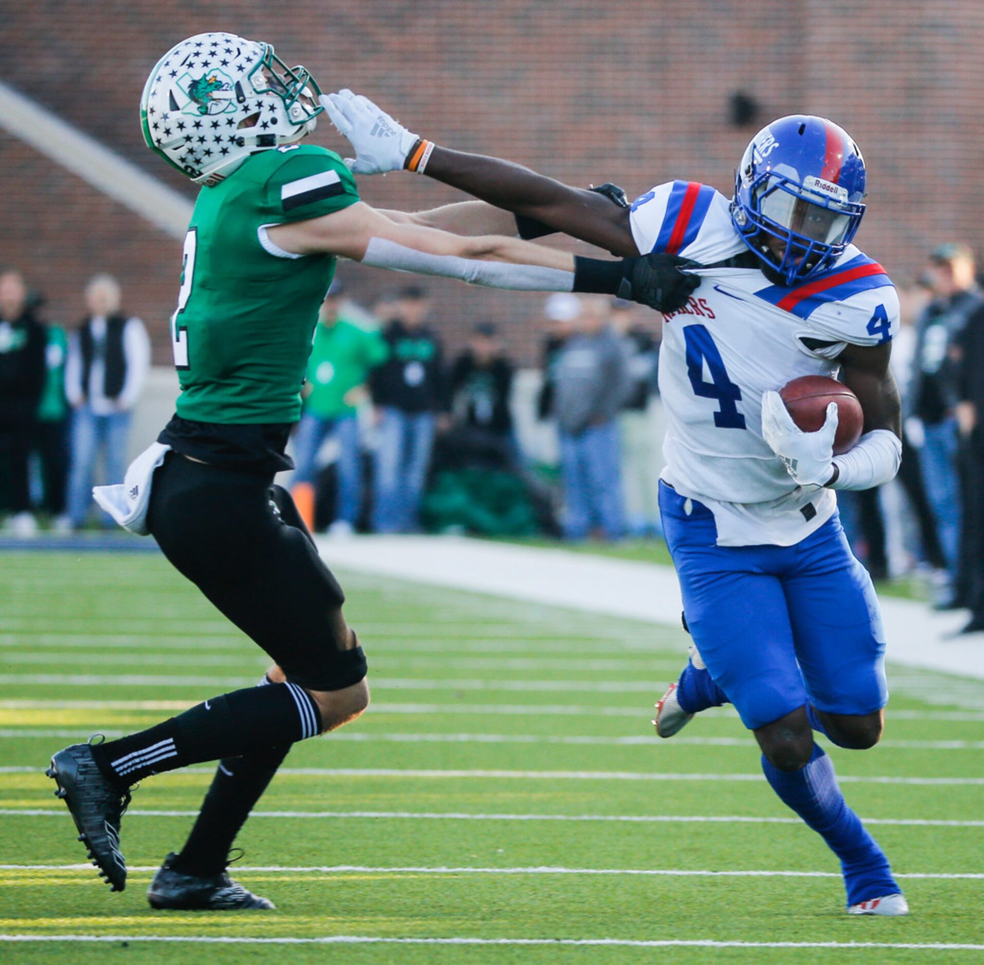 Duncanville wide receiver Zeriah Beason (4) breaks past Southlake Carroll defensive back...