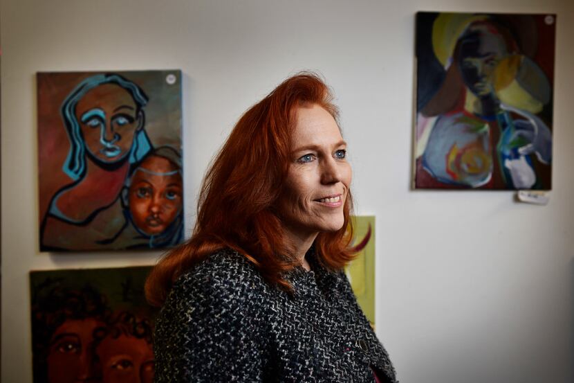 Brenda Snitzer, executive director of The Stewpot, photographed with artwork from members of...