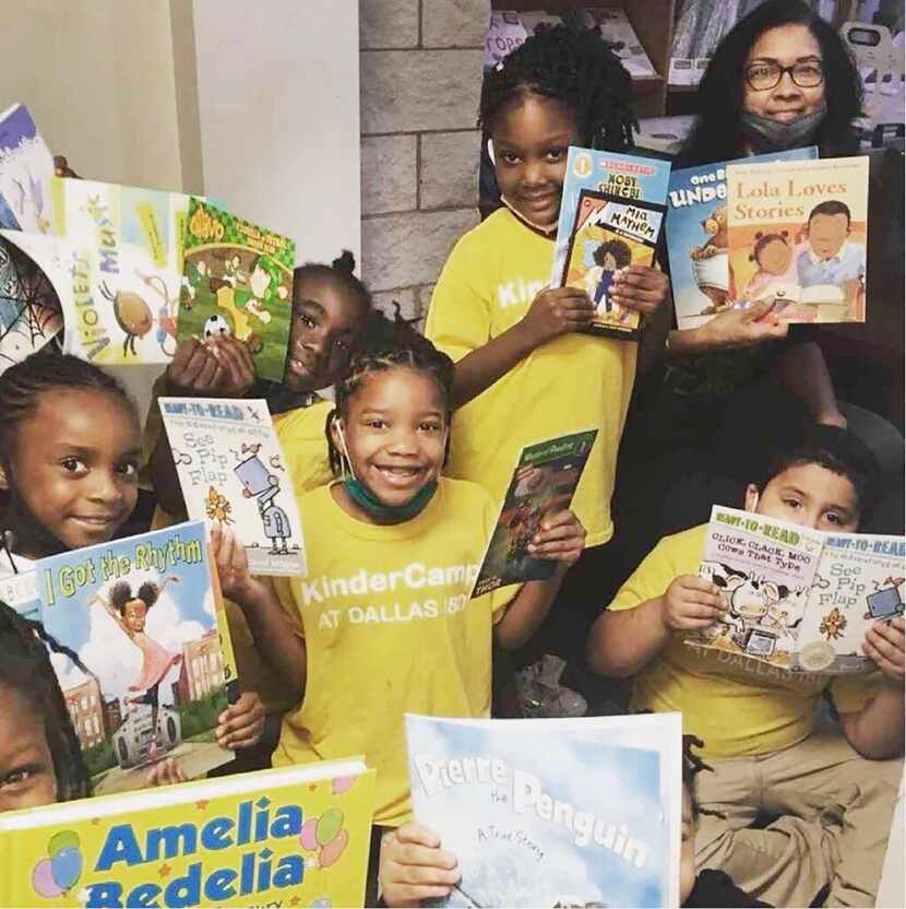 Students at H.I. Holland at Libson elementary school are shown with books they're reading as...