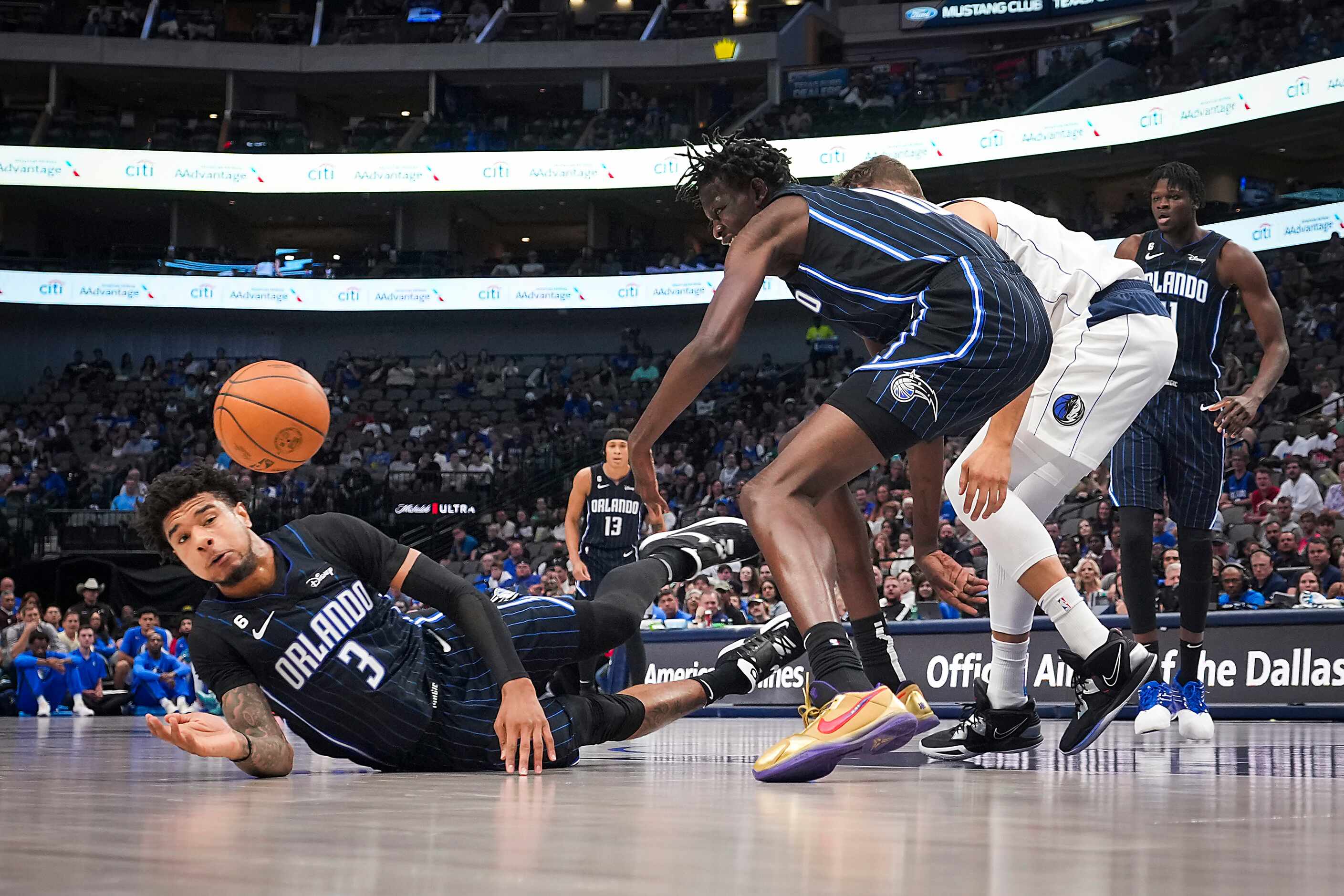 Orlando Magic forward Chuma Okeke (3) dives for a loose ball during the first half of an NBA...