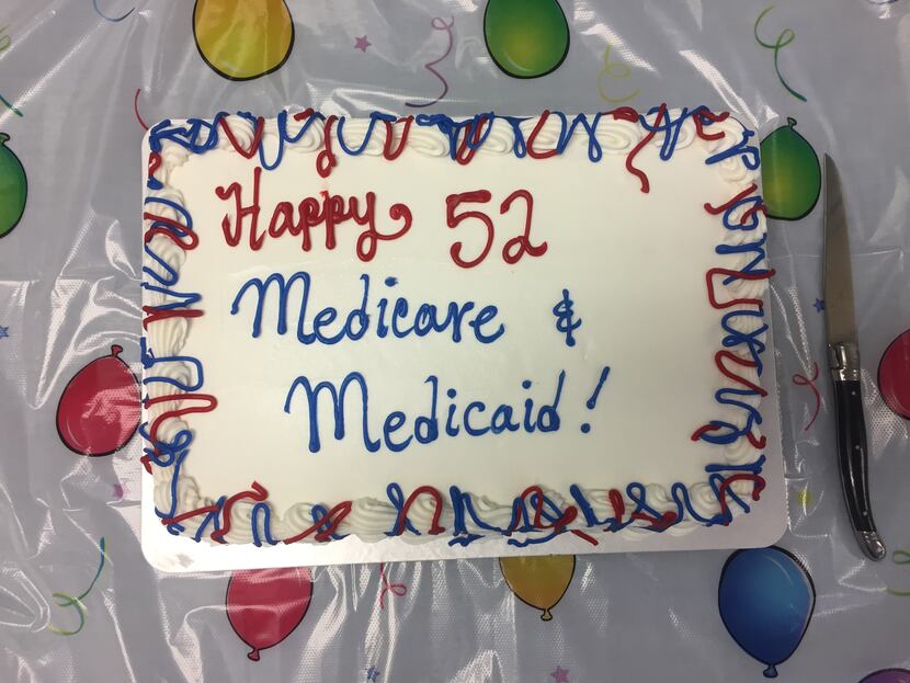 A birthday cake for Medicare and Medicaid sits on a table at the meeting of the Texas...