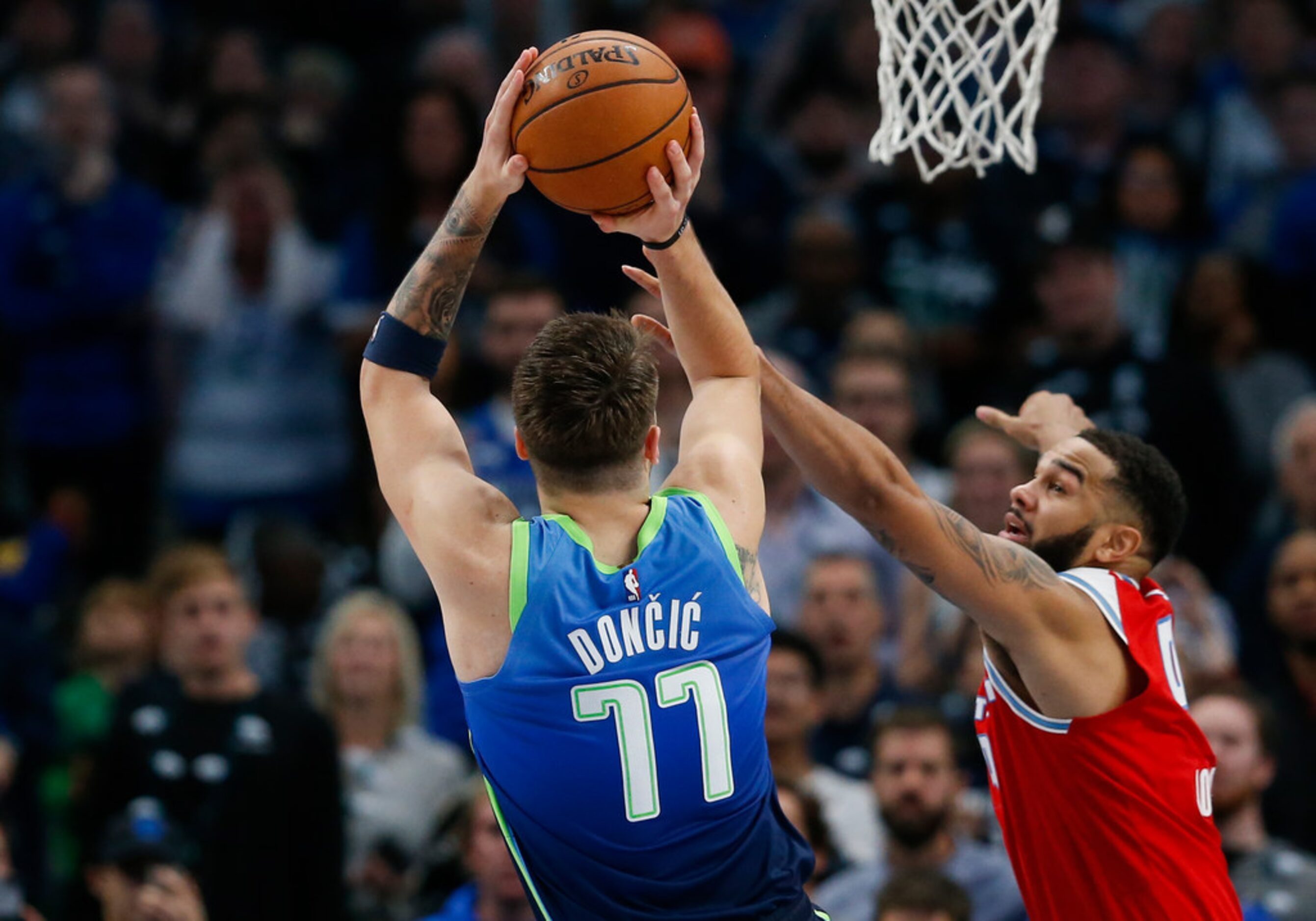 Sacramento Kings guard Cory Joseph (9) guards Dallas Mavericks forward Luka Doncic (77)...