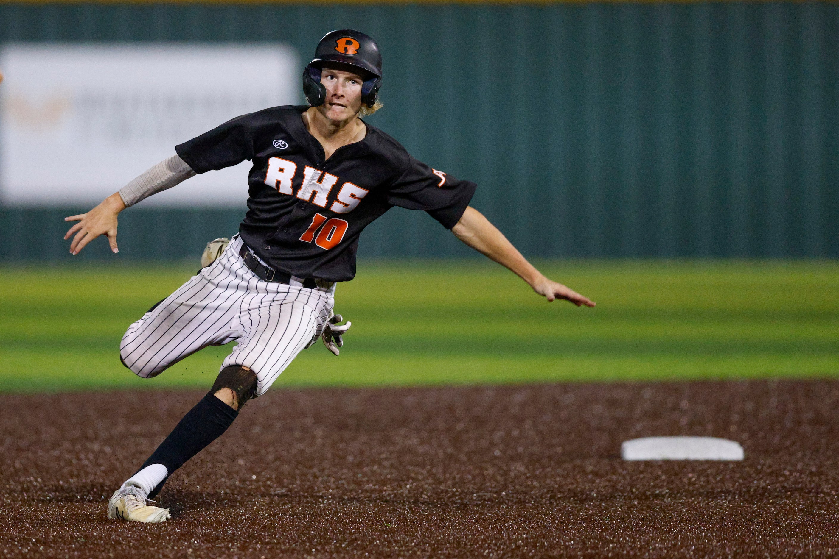 Rockwall third baseman Pearson Riebock (10) rounds second base during a Class 6A Region II...