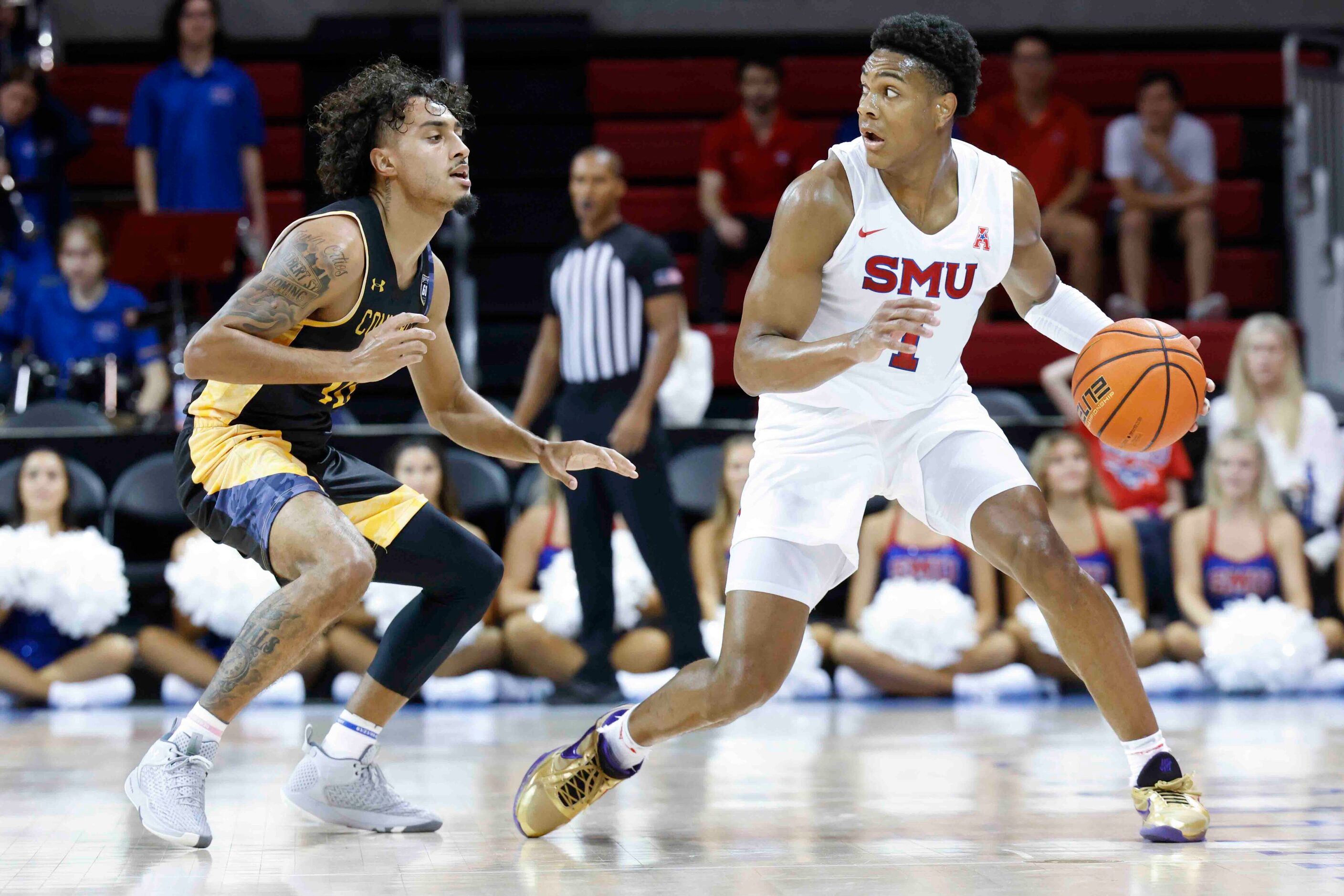 Southern Methodist guard Zhuric Phelps (1), right, looks to pass past Texas A&M-Comm’s...