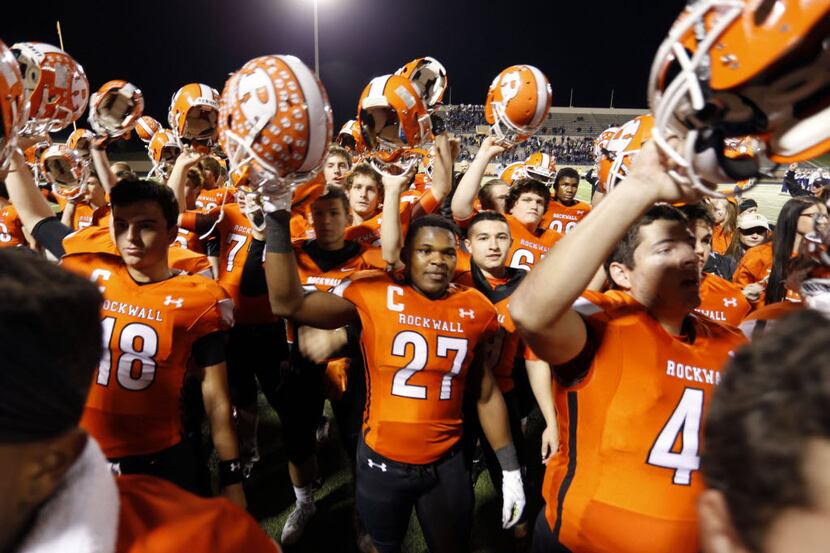 (TXHSFB) Rockwall RB Caleb Broach (27) celebrates with teammates at the end of Rockwall's...