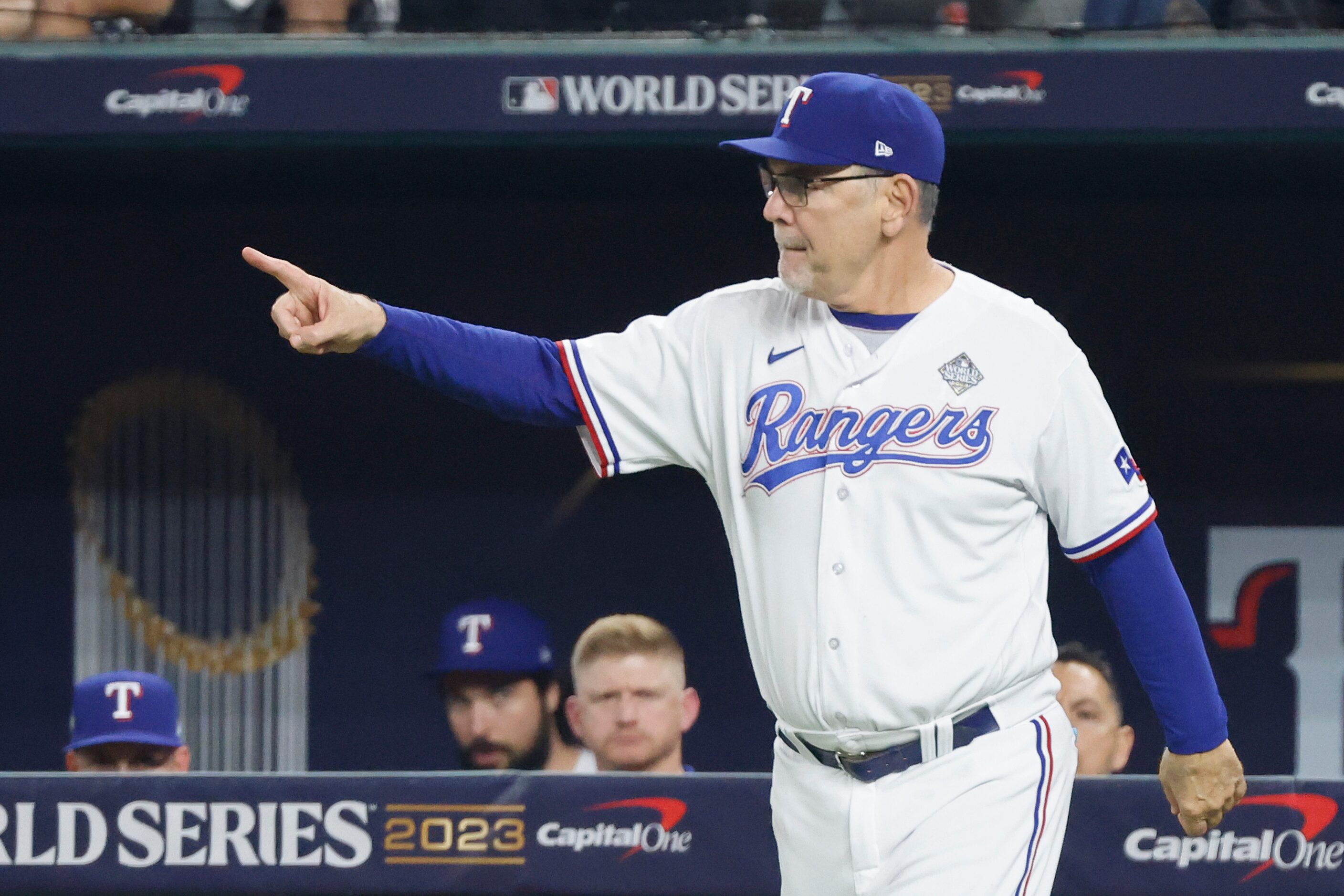 Texas Rangers manager Bruce Bochy makes a call to the bullpen during the eighth inning in...