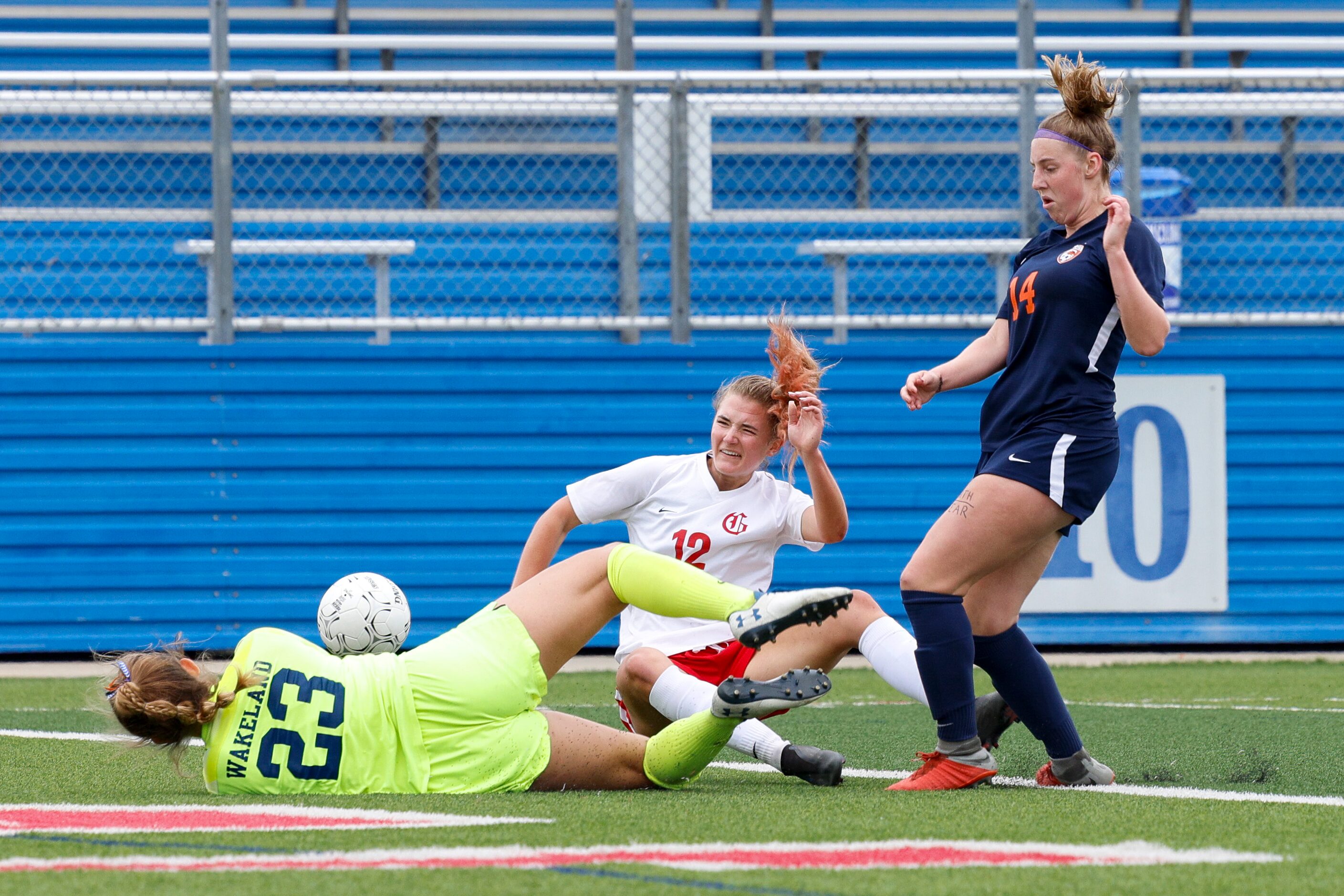 Frisco Wakeland goalkeeper Drew Stover (23) blocks a shot from Grapevine forward Samantha...