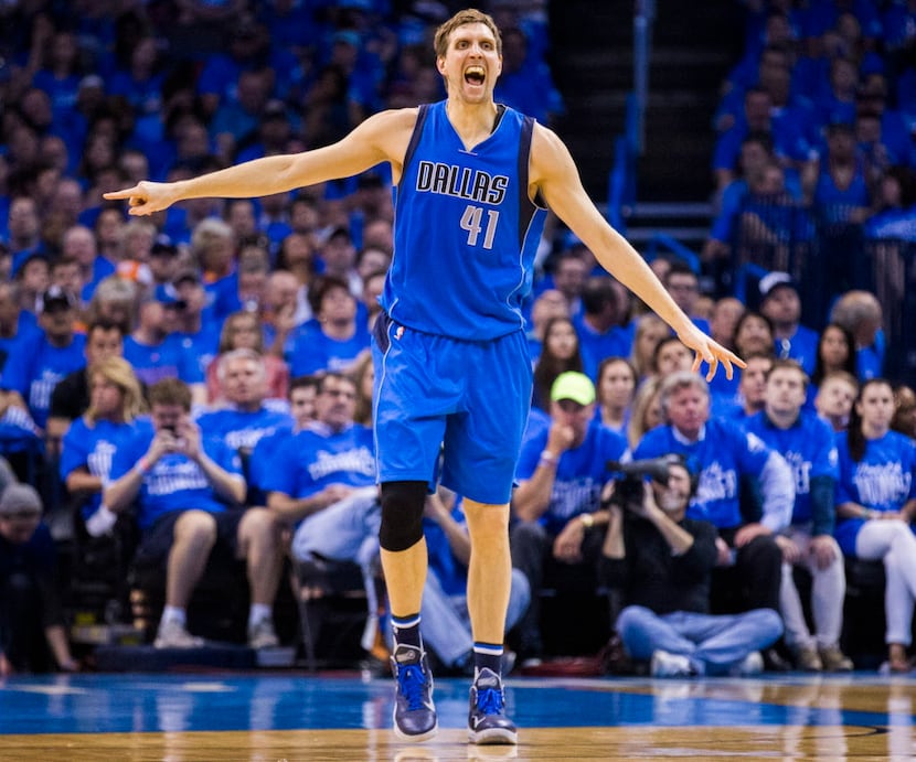 Dallas Mavericks forward Dirk Nowitzki (41) yells at his teammates across the court during...