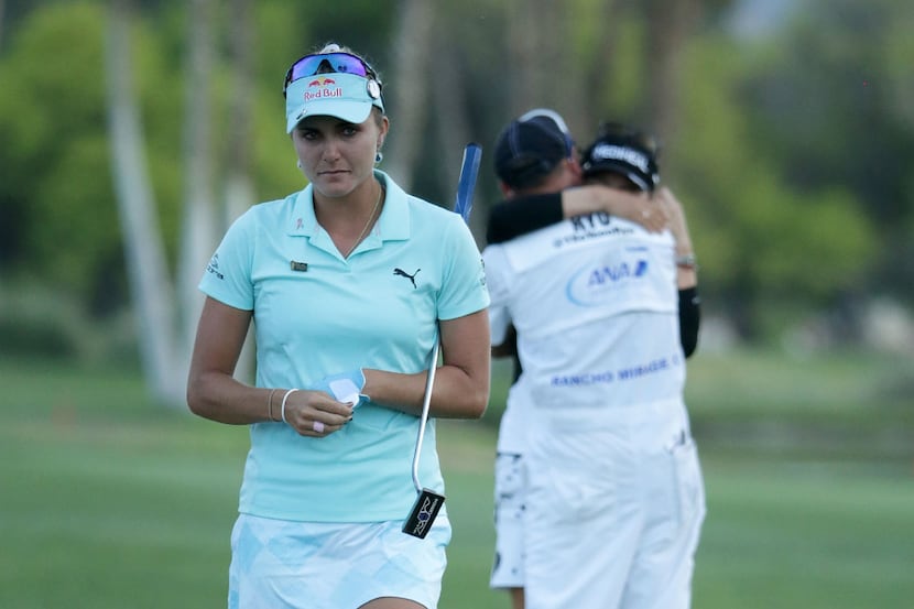 RANCHO MIRAGE, CA - APRIL 02:  Lexi Thompson (L) walks off the 18th green, as So Yeon Ryu of...