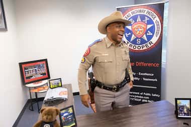 DPS Sgt. Germaine Gaspard stands behind his desk following a press conference announcing the...