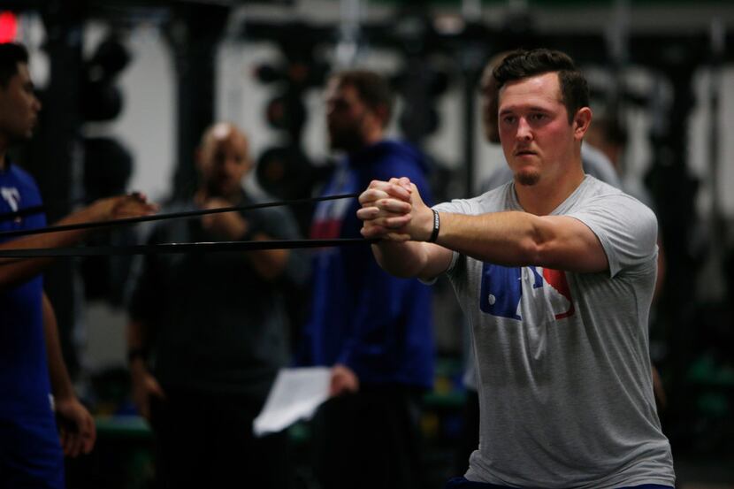 Texas Rangers minor league pitcher Nick Gardewine works out during training at Arlington...