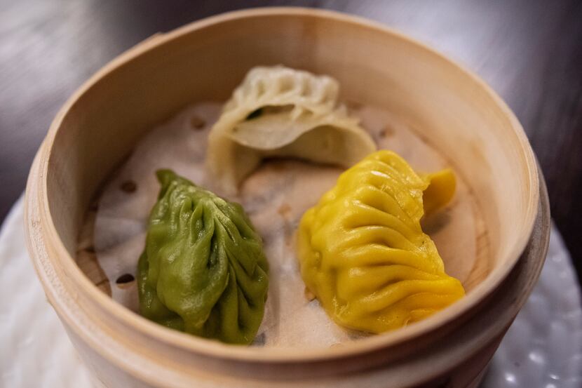 A comb dumpling of veggie, left, pork/shrimp and chicken, right, from Kitchen Master in...
